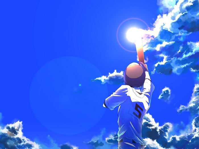 Baseball player swinging bat at the sun