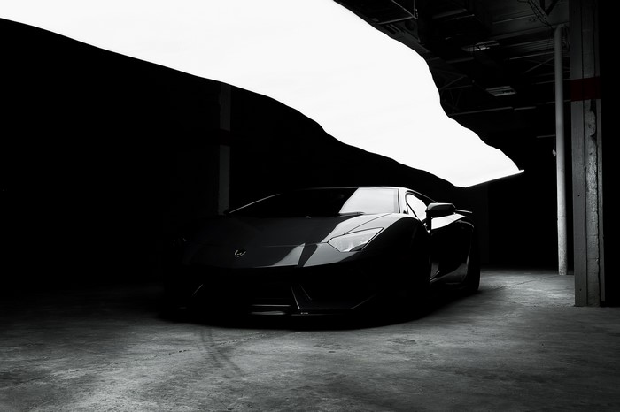 4K monochrome Lamborghini Aventador in dark garage