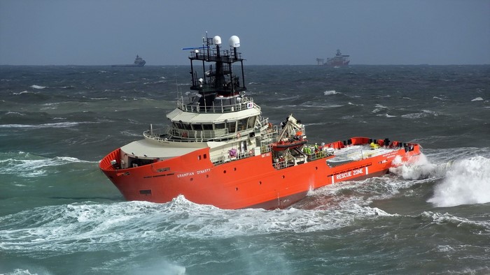 Orange rescue ship navigating rough seas
