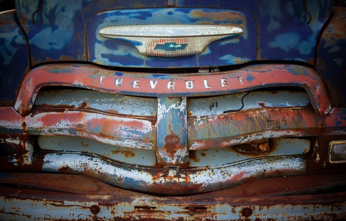 Close-up of a rusty old Chevrolet truck grille