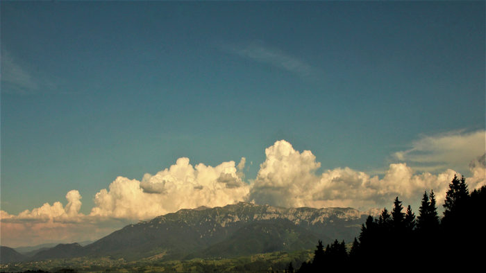 Mountain range with clouds and trees in Romania