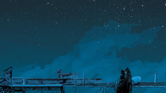 Batman and Catwoman kissing on a rooftop under the stars