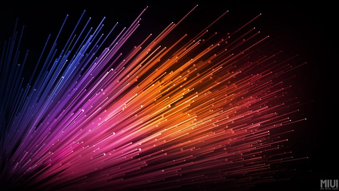 Abstract colorful light beams on black background