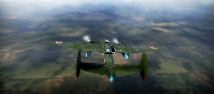 Twin-engine airplane flying over a landscape