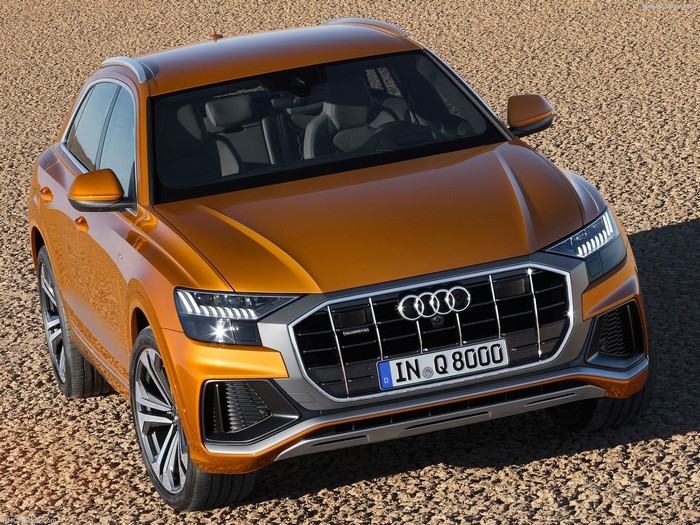 Orange Audi Q8 2019 parked on gravel