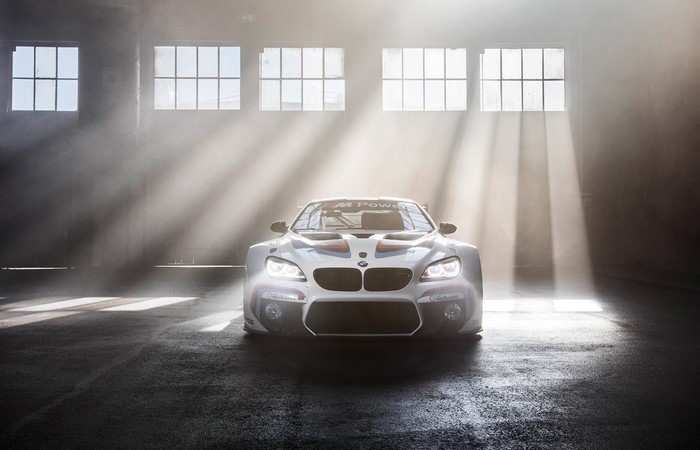 BMW M Power race car in a warehouse