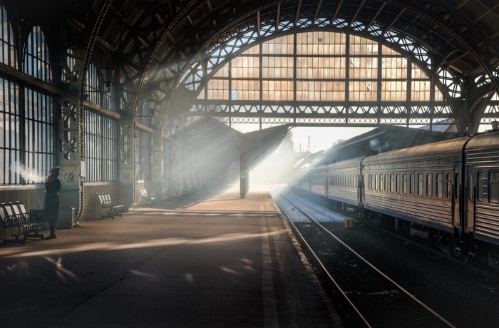 Woman at St. Petersburg train station with train
