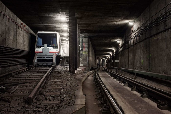 Subway train in a dark concrete tunnel in Hamburg, Germany