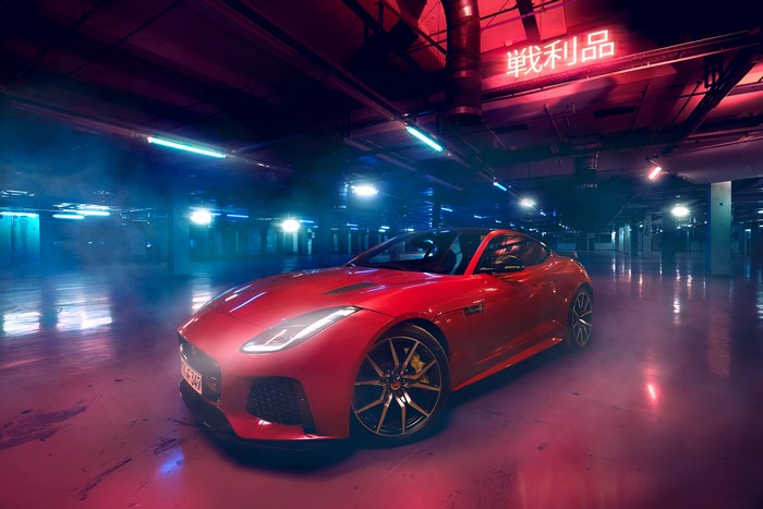 Red Jaguar F-Type in a dimly lit parking lot
