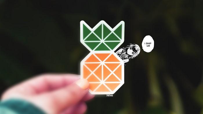 Anime girl peeking from behind a pineapple sticker