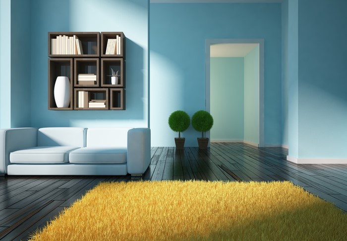 Minimalist room with bookshelf and yellow carpet