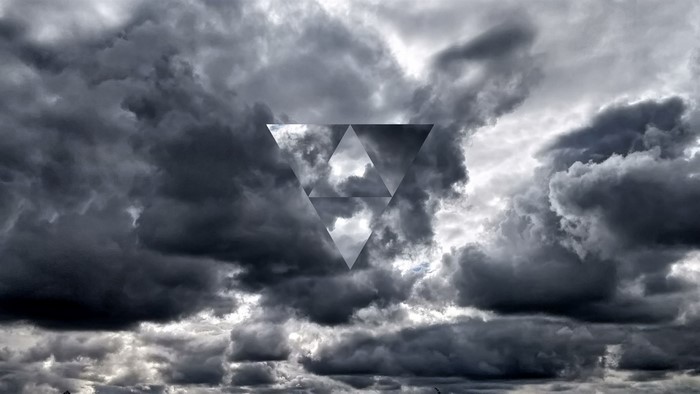 Dark clouds with a geometric triangle overlay