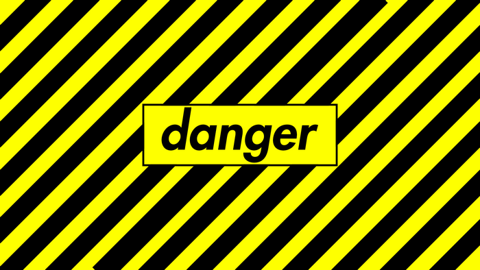 Danger sign with yellow and black stripes