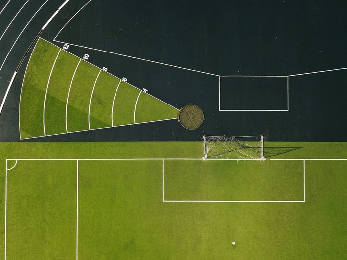 Aerial view of a sports field with running track
