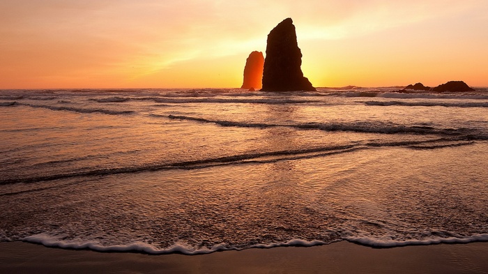 Sea stacks at sunset on a beach