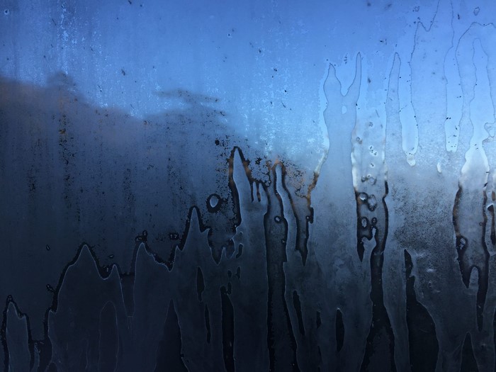 Abstract frost patterns on a blue background