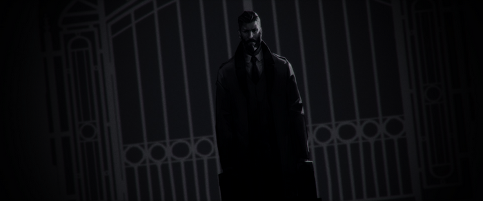Man in trench coat in front of gate
