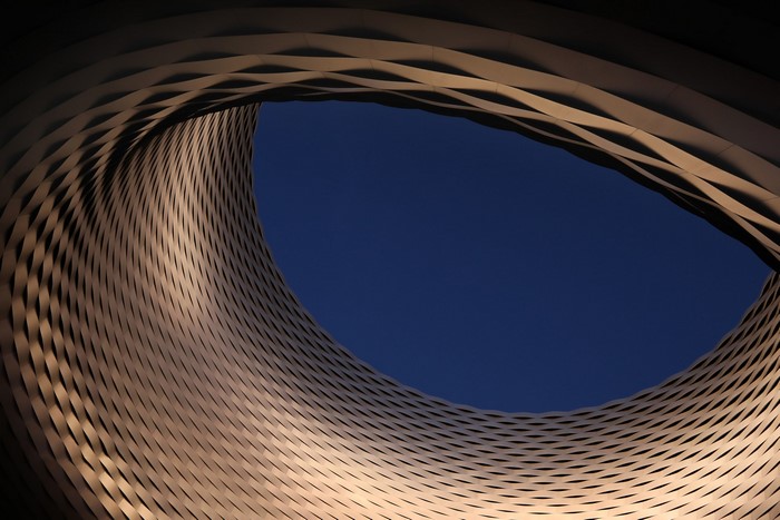 Abstract steel structure against a clear blue sky