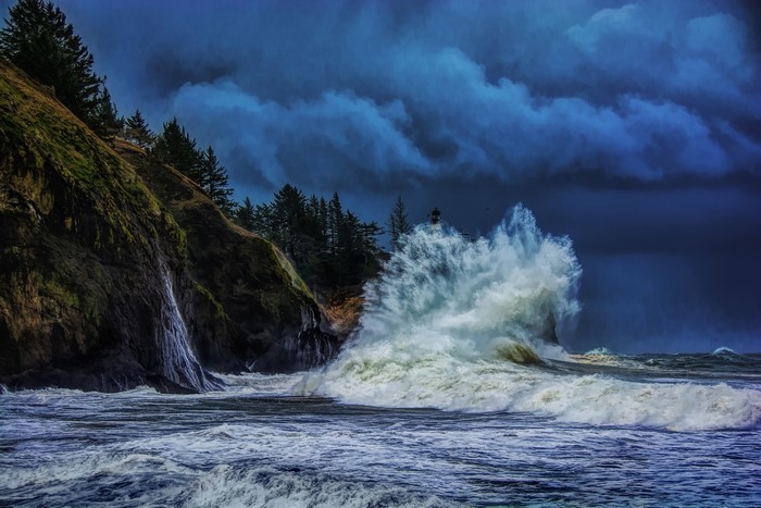 Stormy Waves Crashing Against a Cliff with a Lighthouse
