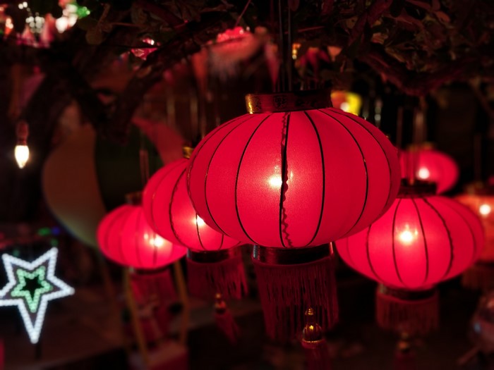 Red lanterns and Christmas lights at night