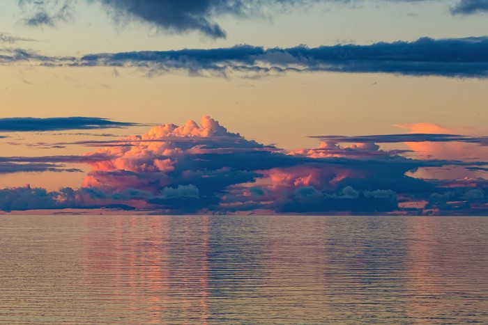 Sunset over the sea with colorful clouds in Russia
