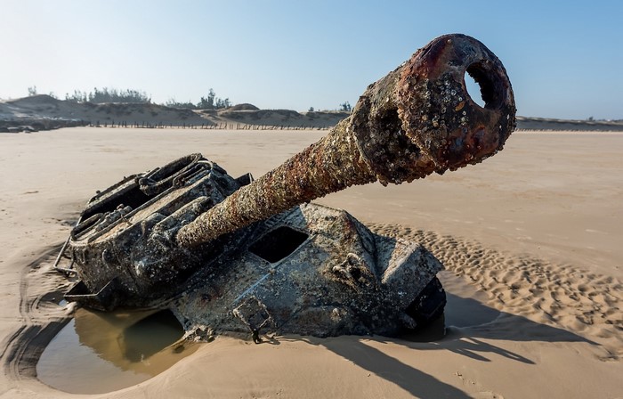 Wreck of an M18 Hellcat tank on a sandy beach