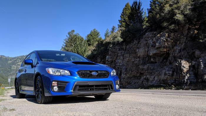 Blue Subaru WRX on a Mountain Road