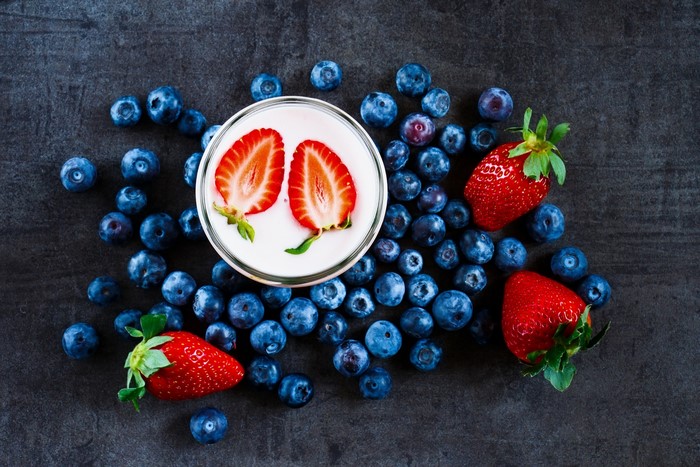 Strawberries and blueberries with yogurt