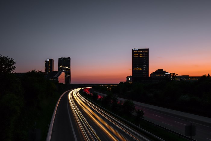 City skyline with light trails at sunset
