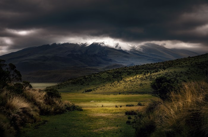 Overcast landscape with snow-capped mountains