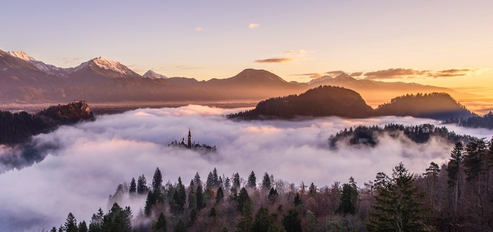 4K landscape of Lake Bled, Slovenia at sunrise with mist