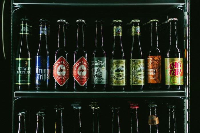 Assortment of beer bottles in a fridge