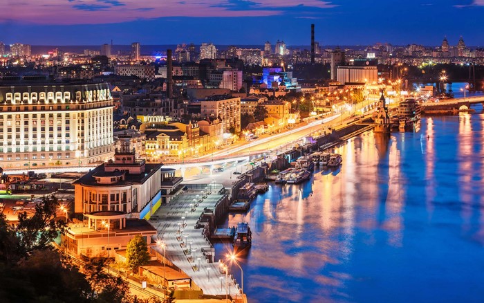 Kyiv cityscape at night with river and city lights