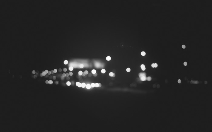 Monochrome blurred bokeh lights at night