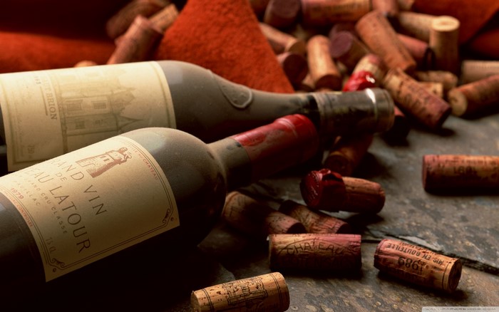 Chateau Latour and Chateau Brion wine bottles with corks
