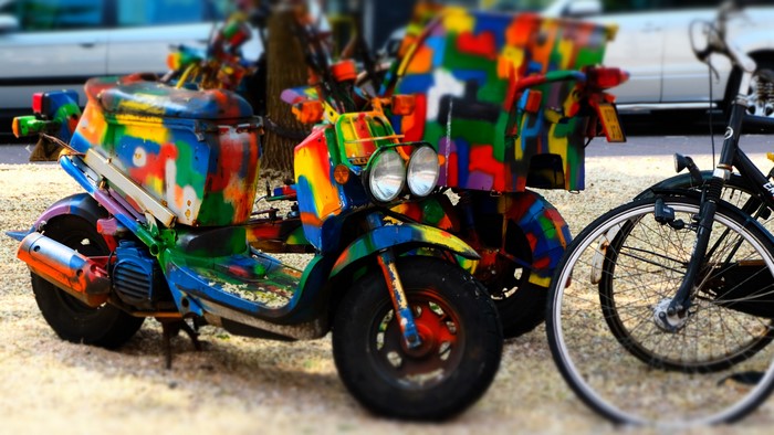 Colorful scooters and bicycle in Netherlands