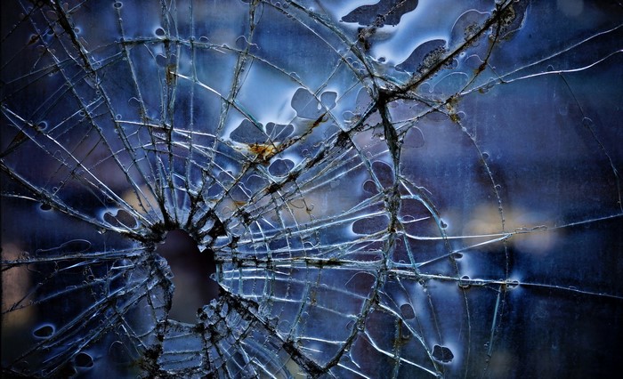 Broken glass with blue background