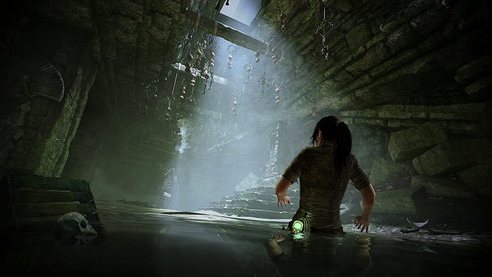 Lara Croft in a flooded tomb in Shadow of the Tomb Raider