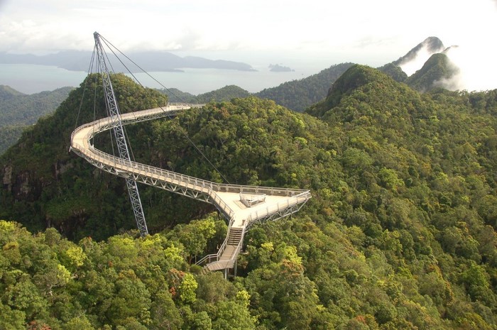 Skybridge over a lush green mountain landscape in Malaysia