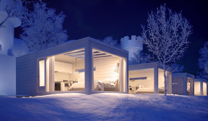 Modern cabins in snowy Lapland at night with tower