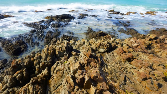 4K Waves Crashing on Rocky Shoreline
