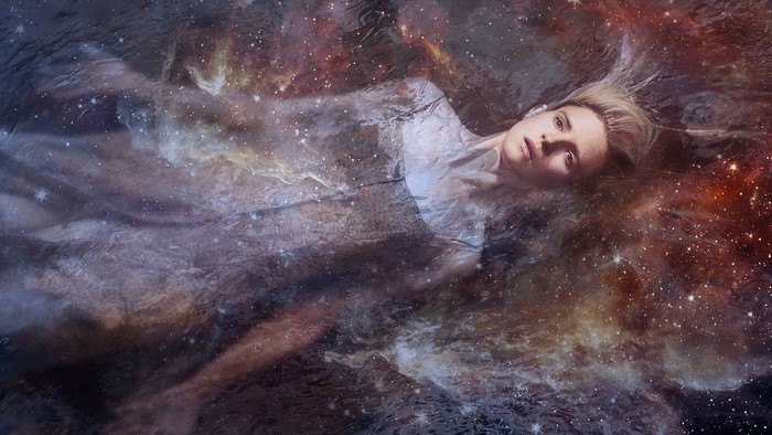 The OA blonde woman floating in galaxy