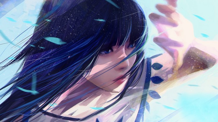Woman with dark hair and blue eyes in the wind