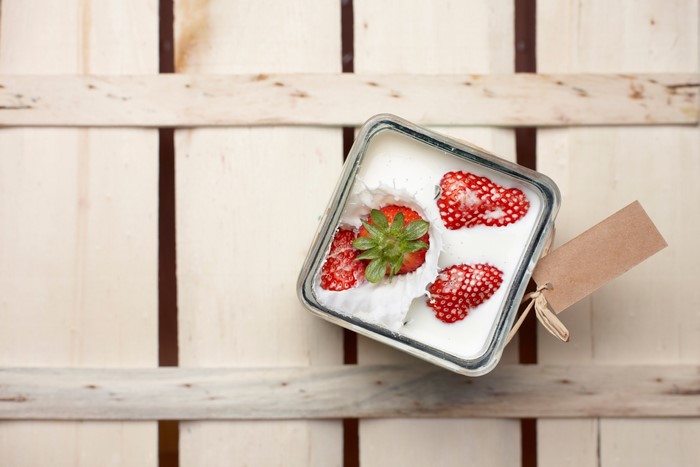 Dessert with strawberries in a glass jar