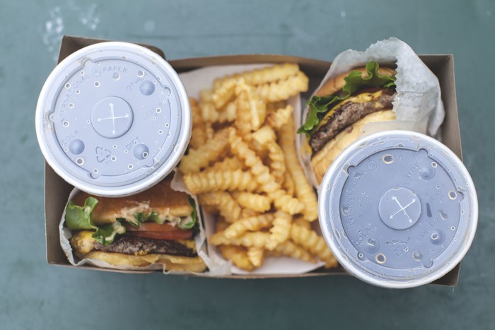 Burgers, fries, and soda in a box