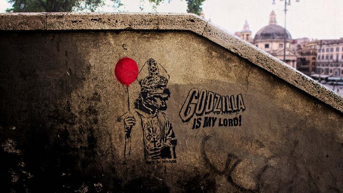 Godzilla graffiti with pope and balloon