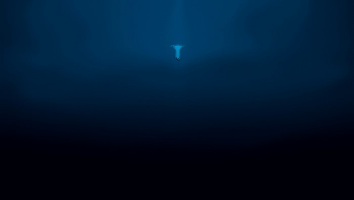 Person falling into deep blue water