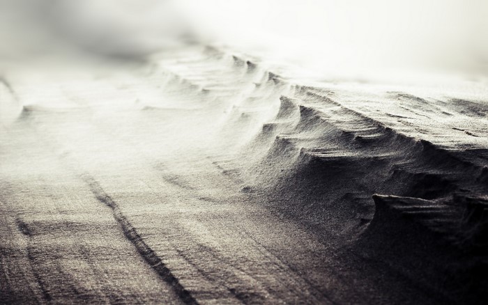 Monochrome nature photography of wind-swept sand dunes