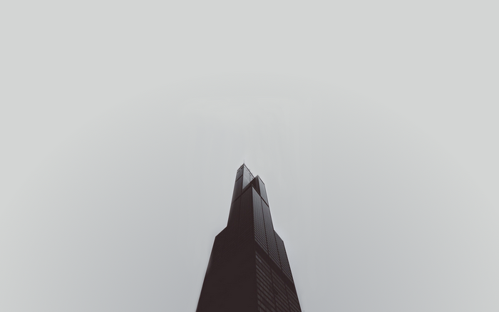 Willis Tower against a minimalist white sky