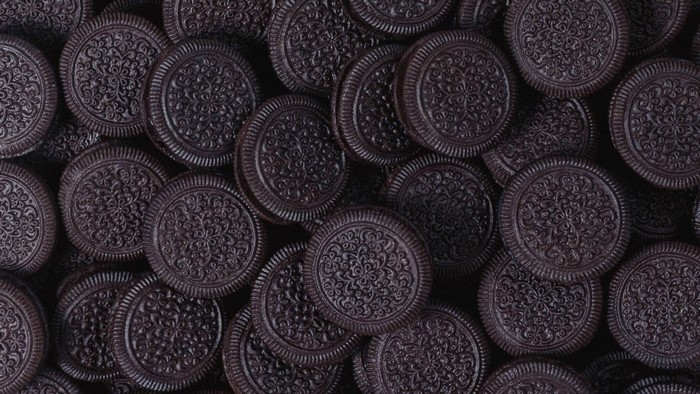 A pile of dark chocolate Oreo cookies